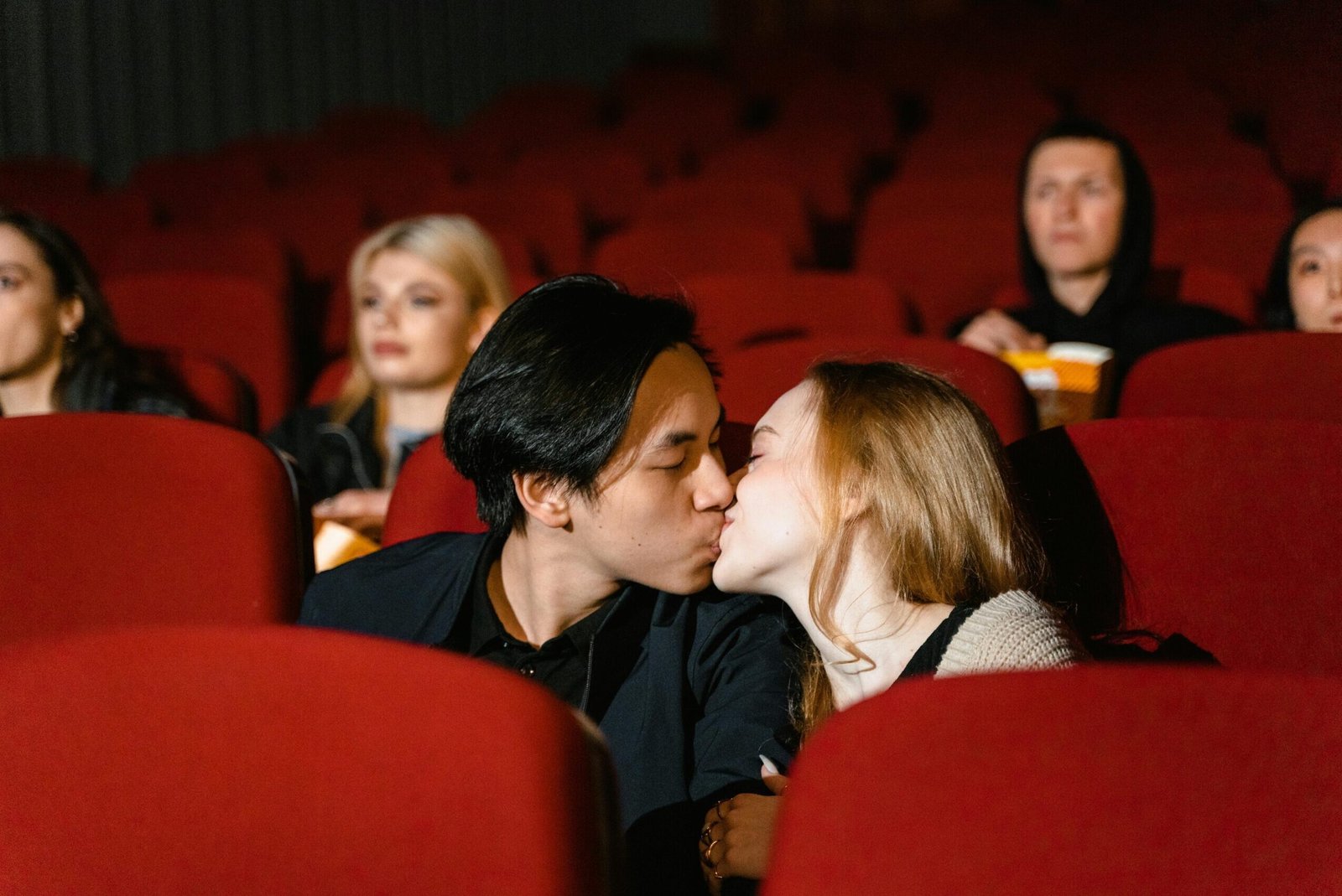 couple kissing in at the movies.